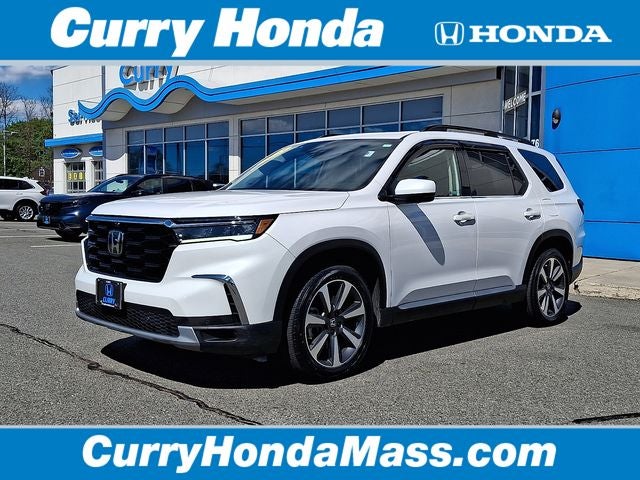 2023 Honda Pilot Elite in White — front three-quarter view